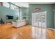 Large living room with hardwood floors, modern furniture and decor, and sliding glass doors to the patio at 9806 Bennington Dr, Tampa, FL 33626