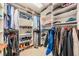 Organized walk-in closet with ample shelving and hanging space for clothes and accessories at 9806 Bennington Dr, Tampa, FL 33626