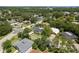 Aerial view of a residential neighborhood showcasing lush green trees and well-maintained homes at 1 Mandarin Ter, Safety Harbor, FL 34695