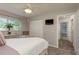 Bedroom featuring carpeted floors, ceiling fan, and a wardrobe at 1 Mandarin Ter, Safety Harbor, FL 34695