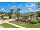 Charming single-story home with a well-manicured lawn and driveway, and tasteful landscaping at 1 Mandarin Ter, Safety Harbor, FL 34695