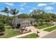 Well-maintained single-Gathering home with landscaped front yard and a cozy patio seating area at 1 Mandarin Ter, Safety Harbor, FL 34695