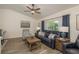 Comfortable living room with wood-look floors, stylish furniture, and a large window offering pleasant natural light at 1 Mandarin Ter, Safety Harbor, FL 34695
