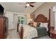 Bedroom featuring carpeted floors, ceiling fan, and access to the outdoor living space at 1 Mandarin Ter, Safety Harbor, FL 34695