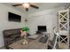 Cozy home office featuring a comfortable leather couch, ceiling fan and closet space at 1 Mandarin Ter, Safety Harbor, FL 34695