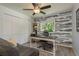 Comfortable office featuring a desk, shelves, and a ceiling fan at 1 Mandarin Ter, Safety Harbor, FL 34695
