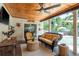 Inviting covered patio with stylish furnishings, perfect for outdoor relaxation by the pool at 1 Mandarin Ter, Safety Harbor, FL 34695