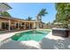 Gorgeous pool area with hot tub, covered patio, and outdoor seating perfect for entertaining at 1 Mandarin Ter, Safety Harbor, FL 34695