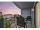 Cozy balcony with seating and views of the city skyline at sunset at 1108 N Franklin St # 502, Tampa, FL 33602