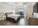This bedroom features a tray ceiling, hardwood floors, and a large window at 1108 N Franklin St # 502, Tampa, FL 33602