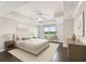 Calm bedroom with tray ceiling, a serene view, and neutral tones for a comfortable retreat at 1108 N Franklin St # 502, Tampa, FL 33602