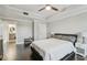 A well-lit bedroom with hardwood floors, a ceiling fan, and access to a bathroom at 1108 N Franklin St # 502, Tampa, FL 33602