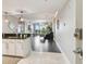Modern condo entryway with tile and hardwood floors, stylish lighting, and an open view to the living area at 1108 N Franklin St # 502, Tampa, FL 33602