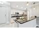 Well-lit kitchen showcasing stainless steel appliances, granite countertops, and a breakfast bar at 1108 N Franklin St # 502, Tampa, FL 33602