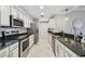 Spacious kitchen featuring stainless steel appliances, granite countertops, and ample cabinet space at 1108 N Franklin St # 502, Tampa, FL 33602