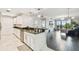 Open-concept kitchen and living area with modern finishes, stainless steel appliances, and hardwood floors at 1108 N Franklin St # 502, Tampa, FL 33602