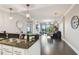 Elegant kitchen with granite countertops, stainless steel appliances, and stylish pendant lighting at 1108 N Franklin St # 502, Tampa, FL 33602