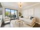 Contemporary living room with a private balcony offering city views and ample natural light at 1108 N Franklin St # 502, Tampa, FL 33602