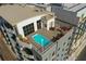 Aerial view of a rooftop pool area with lounge chairs and city views at 1108 N Franklin St # 502, Tampa, FL 33602
