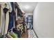 Walk-in closet with custom shelving and ample storage space for clothes and shoes at 1108 N Franklin St # 502, Tampa, FL 33602