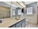 This bathroom features a shower with sliding doors and a vanity with great lighting at 11187 Blythville Rd, Spring Hill, FL 34608