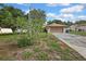Exterior view of a single-story home with a driveway and brown garage door at 11187 Blythville Rd, Spring Hill, FL 34608