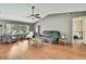 Bright and airy living room with a vaulted ceiling, hardwood floors, and comfortable seating, creating a relaxing atmosphere at 11187 Blythville Rd, Spring Hill, FL 34608
