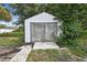 Backyard shed with double doors and a concrete foundation at 11187 Blythville Rd, Spring Hill, FL 34608