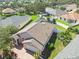 Aerial view of a well-maintained property with lush landscaping and a private backyard at 1135 Millbrook Cir, Bradenton, FL 34212