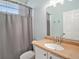 Cozy bathroom with a vanity, mirror, and shower with a curtain at 1135 Millbrook Cir, Bradenton, FL 34212