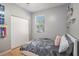 Neutral bedroom with a bed, window, and closet at 1135 Millbrook Cir, Bradenton, FL 34212