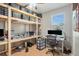 Bedroom with desk, chair, and shelving storage at 1135 Millbrook Cir, Bradenton, FL 34212