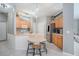 Well-equipped kitchen with stainless steel appliances, light wood cabinets, and breakfast bar at 1135 Millbrook Cir, Bradenton, FL 34212