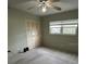 Bedroom with a ceiling fan, gray carpeting, closet, and a window at 11485 Oakhurst Rd # 1200-214, Largo, FL 33774