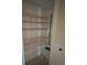 Linen closet with wire shelves, broom and ample storage space at 11485 Oakhurst Rd # 1200-214, Largo, FL 33774