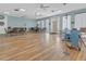 A bright community room with tables, chairs, and a large open floor at 11485 Oakhurst Rd # 1200-214, Largo, FL 33774