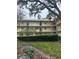 Well maintained building with exterior balconies and manicured shrubbery at 11485 Oakhurst Rd # 1200-214, Largo, FL 33774