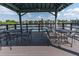 Lake gazebo with tables and chairs, perfect for enjoying the surrounding water views at 11485 Oakhurst Rd # 1200-214, Largo, FL 33774