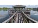 Wooden gazebo overlooking the lake, offering seating and shade for outdoor enjoyment and gatherings at 11485 Oakhurst Rd # 1200-214, Largo, FL 33774