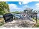 Enjoy beautiful lake views from this grill and gazebo, perfect for outdoor grilling and relaxing at 11485 Oakhurst Rd # 1200-214, Largo, FL 33774