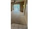 Open living room with a ceiling fan and access to a covered balcony at 11485 Oakhurst Rd # 1200-214, Largo, FL 33774