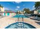 Beautiful outdoor pool area featuring a jacuzzi and several lounge chairs at 11485 Oakhurst Rd # 1200-214, Largo, FL 33774