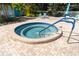 Relaxing jacuzzi area with blue tile and a handrail for easy access at 11485 Oakhurst Rd # 1200-214, Largo, FL 33774