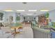 Bright rec room with a poker table, ping pong, bookcases, comfortable seating and lots of games at 11485 Oakhurst Rd # 1200-214, Largo, FL 33774