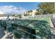 A view of a shuffleboard court, benches and palm trees at 11485 Oakhurst Rd # 1200-214, Largo, FL 33774