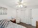 This bedroom has a white ceiling fan and two closets, perfect for maximizing space at 11762 Barb Ct, Seminole, FL 33778