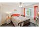 Cheerful bedroom with flamingo themed decor, window and bedside table at 11762 Barb Ct, Seminole, FL 33778