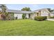 Charming single-story home with stone accents and a well-maintained lawn at 11762 Barb Ct, Seminole, FL 33778