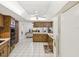 Spacious kitchen with tiled floors, wooden cabinetry, and an open layout at 11762 Barb Ct, Seminole, FL 33778