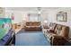 Cozy living room with comfortable seating, carpet flooring, and natural light at 11762 Barb Ct, Seminole, FL 33778